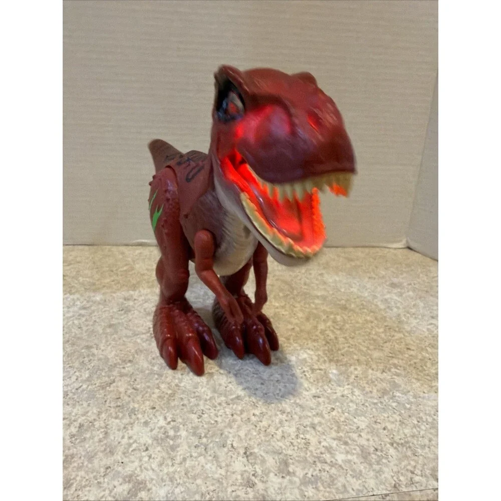 Red T-Rex Dinosaur Toy. Electronic Walking Light Up Sound Figure